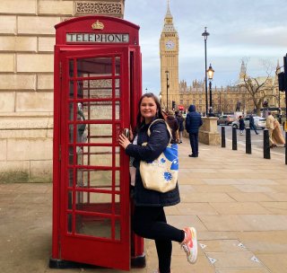 woman at red telephone booth
