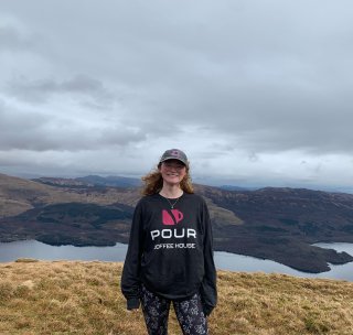 woman in overcast hills