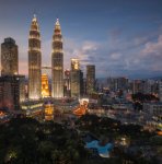 modern city with skyscrapers and bright lights