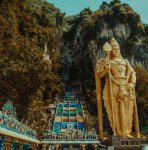 large golden statue at mountain shrine