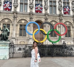 Olympic rings in front of historic building